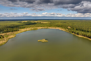 ariel top view of an old flooded lime quarry with turquoise water