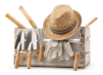 Gardening tools set, wooden crate with aluminum garden kit tools, Trowel with wooden handle, straw hat and protective gloves, isolated on white background. Concept of work or sale garden products