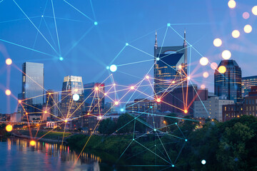 Panoramic view of Broadway district of Nashville over Cumberland River at illuminated night skyline, Tennessee, USA. Social media icons. The concept of networking and establishing people connections