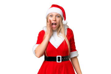 Young blonde woman with christmas hat over isolated chroma key background with surprise and shocked facial expression