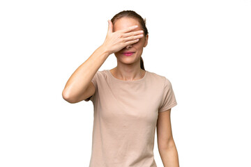 Young caucasian woman over isolated background covering eyes by hands. Do not want to see something