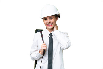 Young architect woman with helmet and holding blueprints over isolated background laughing