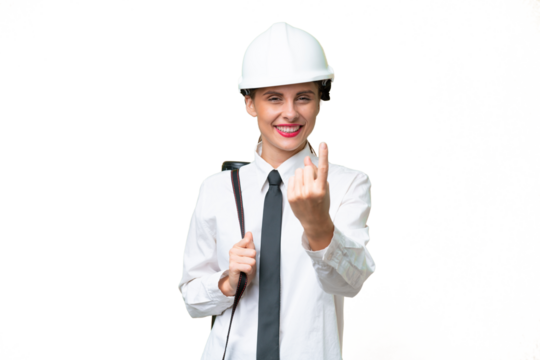 Young architect woman with helmet and holding blueprints over isolated background doing coming gesture