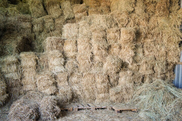 a barn full of hay bales on the farm