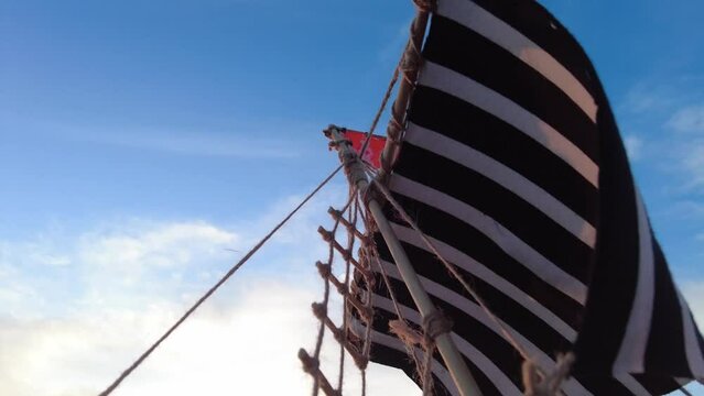 mast sailing ancient viking ship goes downwind close up
