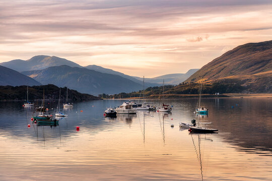 Boats at anchor at dawn in Ullapool, Highlands, Scotland