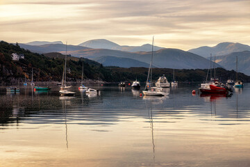 Boats at anchor at dawn in Ullapool, Highlands, Scotland