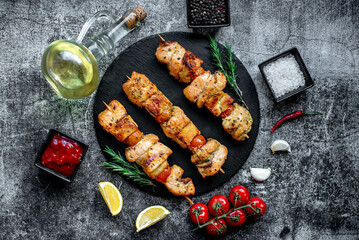 salmon kebab on skewers,grilled on a stone background.