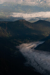 Clouds over mountain village in Alps