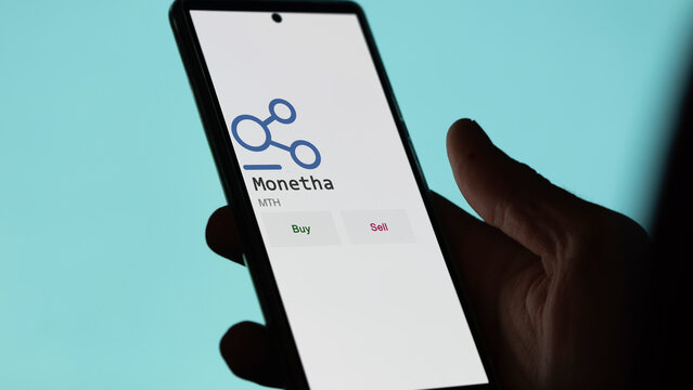 March 27 2023 London UK. An investor analyzing the Monetha coin  to invest in MTH