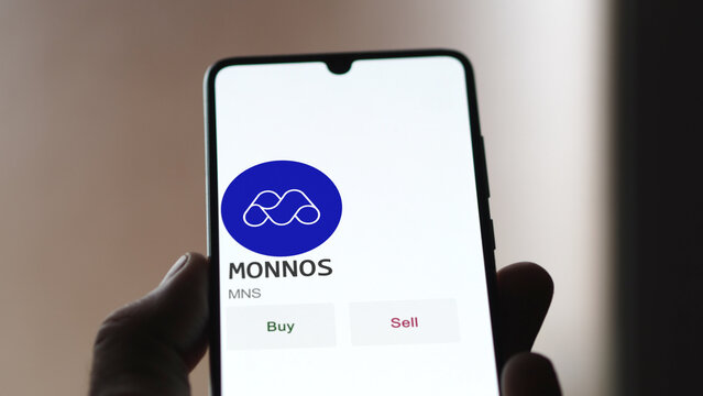 March 27 2023 London UK. An investor analyzing the MONNOS coin  to invest in MNS