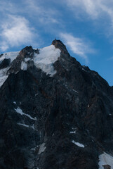 View on snow on mountain top in Alps in sunny day