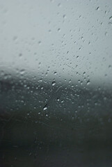 View on raindrops on car window