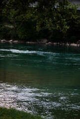 Fototapeta na wymiar River with clear water in mountains in Alps