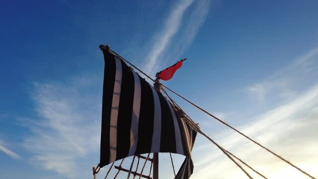mast sailing ancient viking ship goes downwind close up

