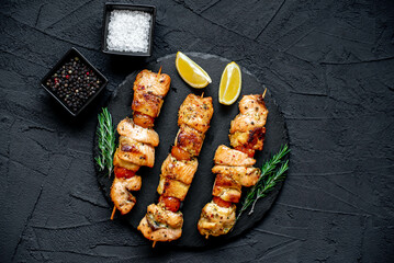 salmon kebab on skewers,grilled on a stone background.