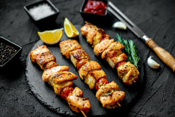 salmon kebab on skewers,grilled on a stone background.