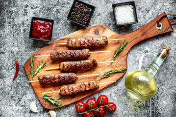 Grilled homemade lula kebab on a stone background