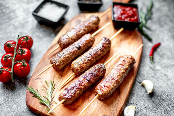 Grilled homemade lula kebab on a stone background