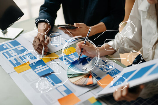 Asian businessman and woman people meeting in office. Employee brainstorm and work as team, plan and discuss project by point on paper and tablet. - Powered by Adobe