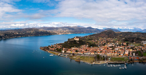 Fototapeta na wymiar panorama landscape of Lake Maggiore and Angera with Borromeo Castle on the hilltop