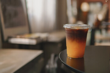 Americano coffee with orange juice. Blank coffee with disposable plastic cup.