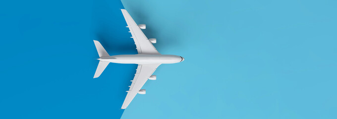 Travel concept with plane on blue background with copy space.