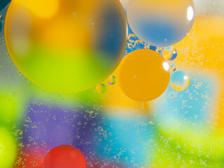 A colorful background with bubbles and water droplets. mulicolor backdrop and blurred with oil...