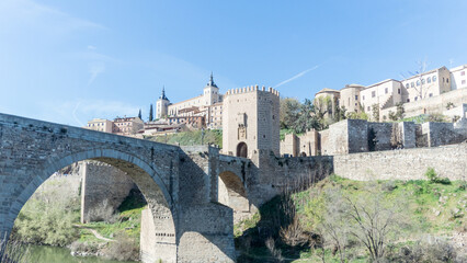 The Puente de Alcantara, a Roman arch bridge in Toledo, Catile-La Mancha, Spain, spanning the Tajo River.