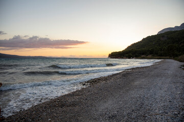 sunset over the sea on the beach and clouds