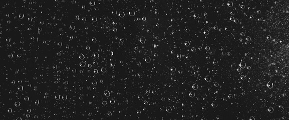 Atmospheric minimal grayscale backdrop with rain droplets on glass. Wet window with rainy drops and...