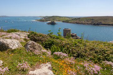 Tresco, Isles of Scilly, UK: view over New Grimsby Sound from Castle Down, with Cromwell's Castle below, Bryher on the right and St. Mary's beyond 
