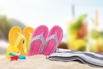 Fototapeta na wymiar towel and flip flops or beach shoes, summer