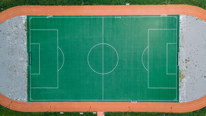 An empty soccer field with running tracks around it © Franchesko Mirroni