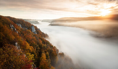 Amazing sunrise and morning fog over the Danube river valley from the Eichfelsen rock near Beuron