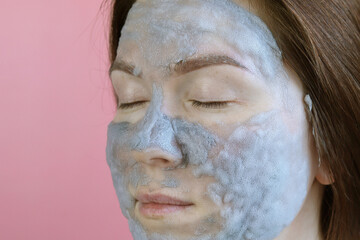 Woman applying bubble cleansing mask