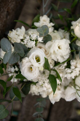 Wedding bouquet of white flowers - ranunculus, freesia, lisianthus.. Wedding. Bride and groom.
