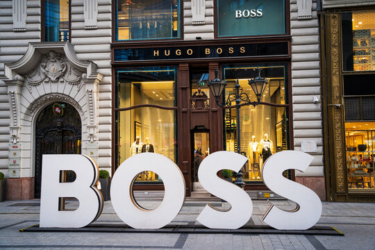 Hugo Boss luxury fashion house store entrance with Boss sign at Fashion Street in Budapest. Budapest, Hungary - February 3, 2023.