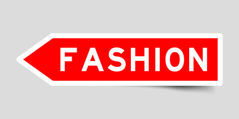 Red color arrow shape sticker label with word fashion on gray background