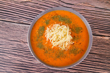 Tomato soup with noodles on a wooden background	
