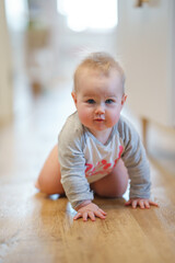 Caucasian cute toddler baby with blue eyes at home