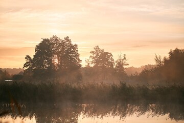 Sunrise over the river. Concept of early waking and new beginning