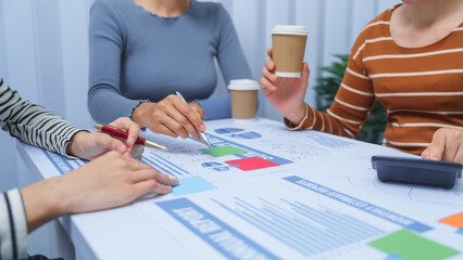 small business accounting team meeting three asian people with salary monthly charts data, basic business accounting and bookkeeping concept.