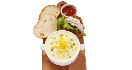 Corn Soup and Bread breakfast menu on white table