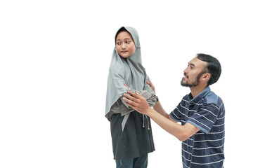 young asian girl upset being comfort by her father over white background