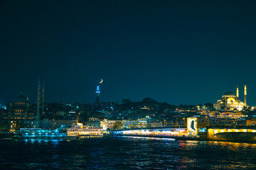 Fototapeta na wymiar Istanbul view with Galata Bridge and Suleymaniye Mosque and crescent moon