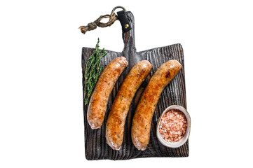 Sausages barbecue fried with spices and herbs on a wooden cutting board. Isolated, transparent...