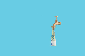 Business and finance concept with euro banknote falling from the faucet or water tap.