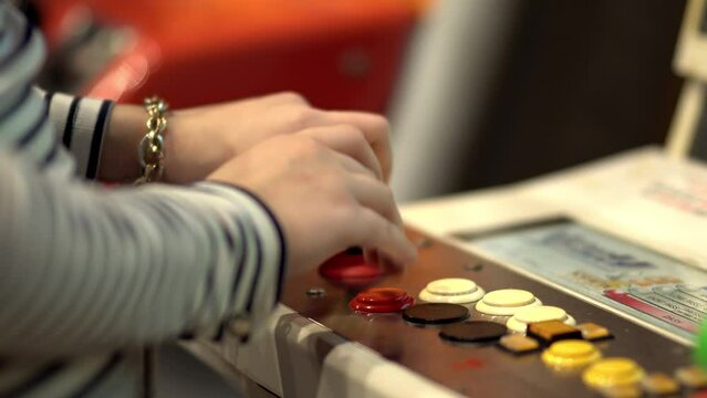 Girl play on joystick of a vintage arcade videogame - Coin-Operated