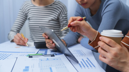 small business accounting team meeting three asian people with salary monthly charts data, basic business accounting and bookkeeping concept.